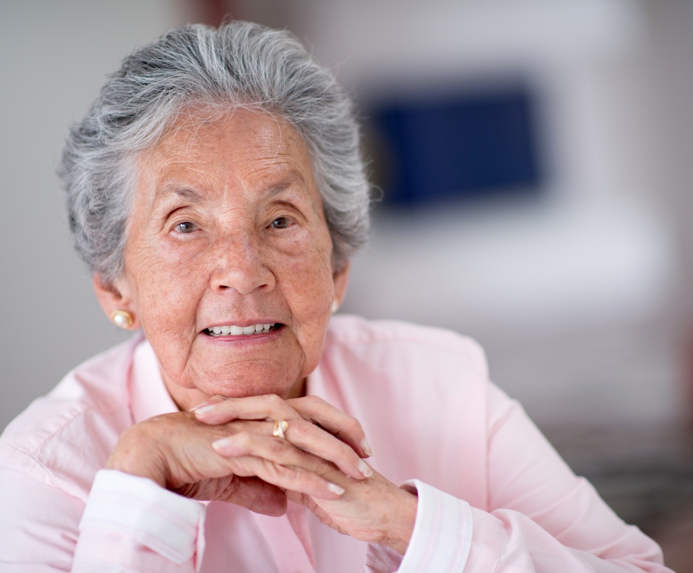 Portrait of a beautiful elder woman smiling at home-1